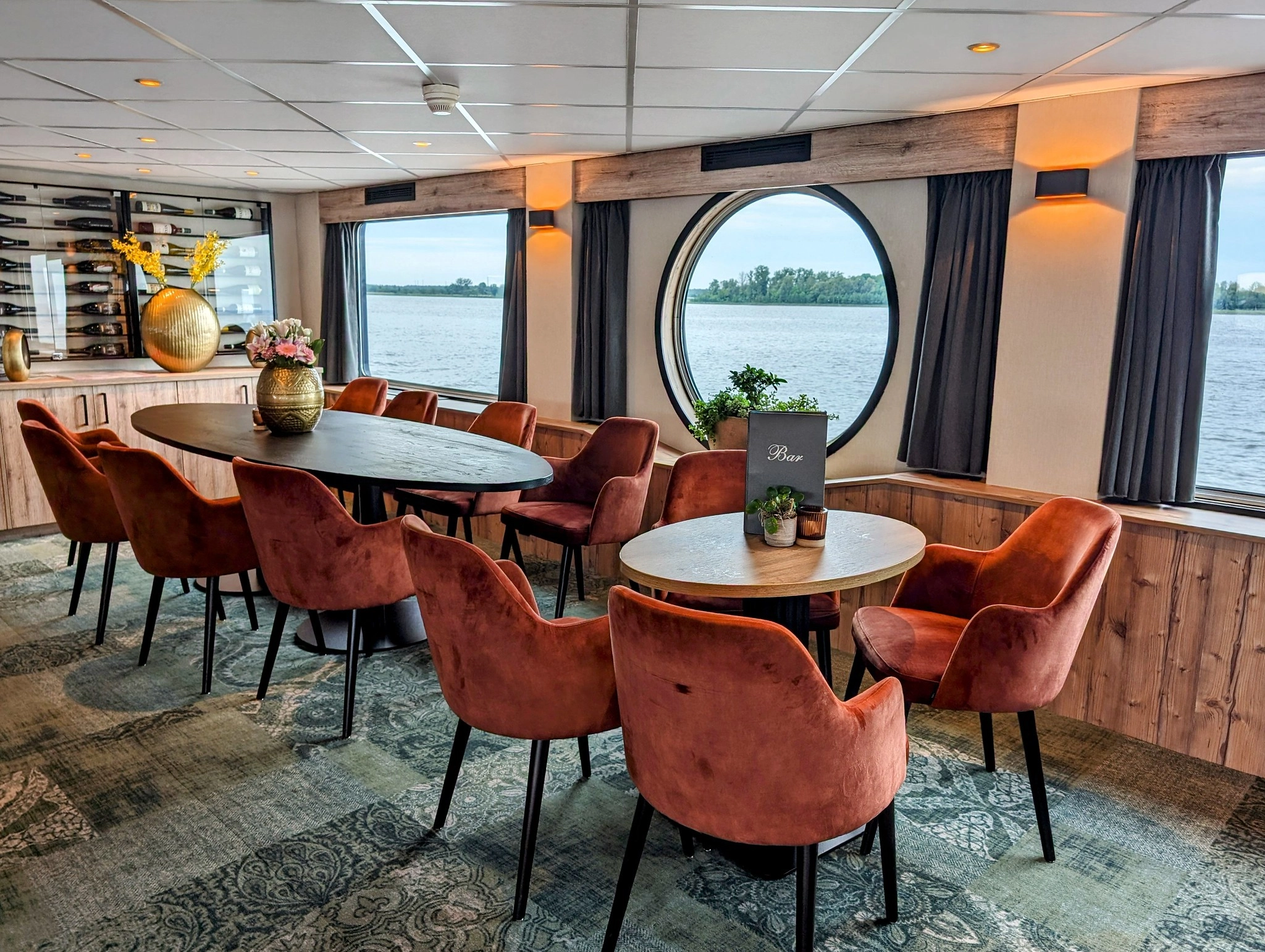 Interior of the MS Princess lounge bar featuring round panoramic windows, modern seating and the renewed interior after the 2024 renovation.