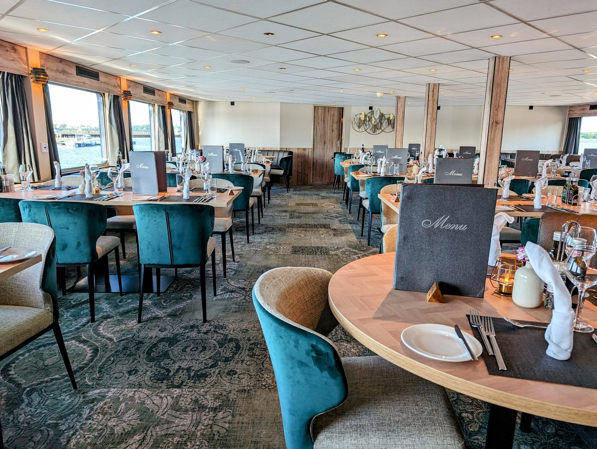 Overview of the MS Princess restaurant with set tables, large windows, and renovated interior following the 2024 refurbishment.